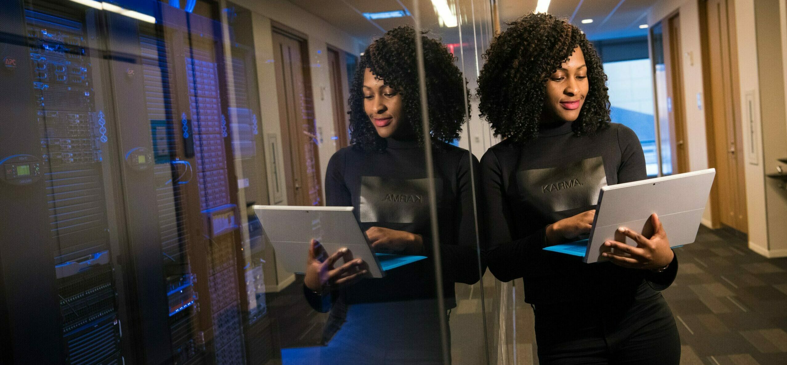 Young female student using laptop NZSE