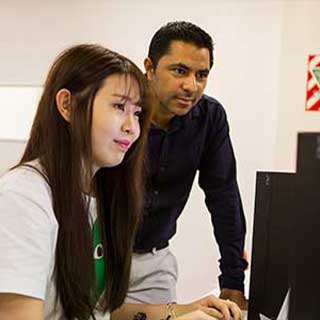 Male tutor and young female student in classroom NZSE