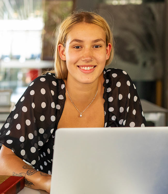 Female student on laptop NZSE