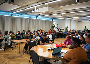 Group of students viewing presentation NZSE
