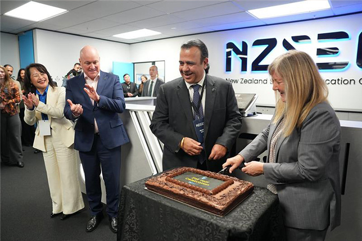 Founder Brijesh Sethi cuts cake with Minister Penny Simmonds